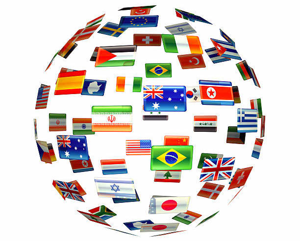 Globe of world flags on a simple white background.